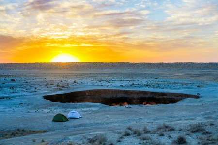 Darvaza Gas Crater Pit Breathtaking Two Tents at Sunriseの写真素材
