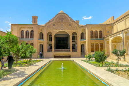 Kashan Boroujerd Historical House Courtyard Frontal View Point with People and Fountain Pondのeditorial素材