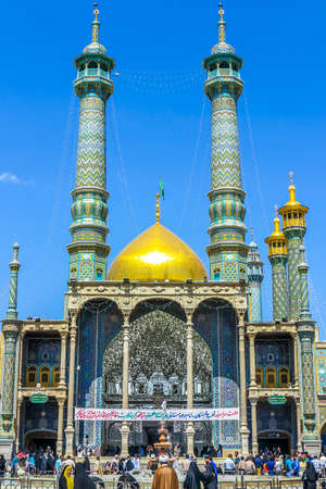 Qom Fatima Masumeh Shrine Front View with Minarets and Crowdのeditorial素材