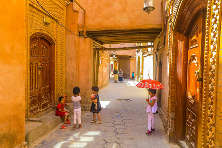 Kashgar Old Town Common Uyghur Architecture Apartment Buildings Street with Playing Little Childrenのeditorial素材