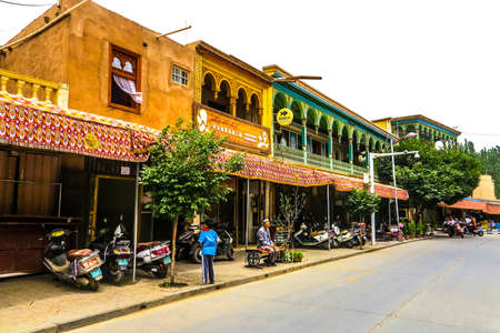 Kashgar Old Town Common Uyghur Market Street with Motorbikesのeditorial素材
