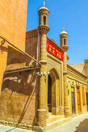 Kashgar Old Town Common Uyghur Architecture Apartment Buildings Street. TRANSLATION: "Love the Communist Party. Love the Country."の写真素材