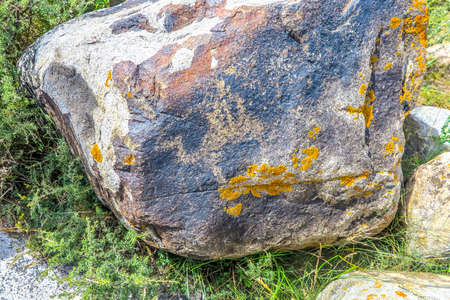Cholpon Ata Petroglyphs with Carved Stone Images of Animals Horses Deers Camels Hunters Balbalsの写真素材
