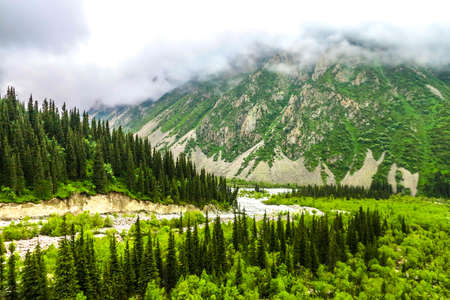 Ala Archa Alpine National Park Landscape near Bishkek with Tian Shan Mountain Range Forest River Fogの写真素材