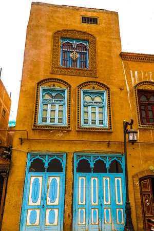 Kashgar Old Town Common Uyghur Architecture Apartment Buildings Facade with Blue Colored Wooden Door...