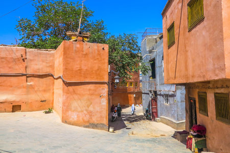 Kashgar Old Town Common Uyghur Architecture Apartment Buildings Street with Walking Old Womenの写真素材