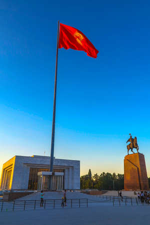 Bishkek Ala Too Square Waving Kyrgyz Flag on Flagpole with Hero Manas Statue and State History Museum View Pointのeditorial素材