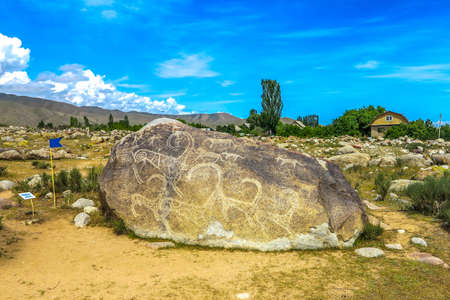 Cholpon Ata Petroglyphs with Carved Stone Images of Animals Horses Deers Camels Hunters Balbalsの写真素材