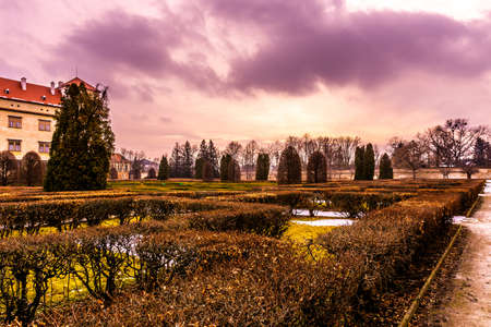 Bucovice Castle Chateau Courtyard Garden with Blue Cloudy Sky at Wintertimeのeditorial素材