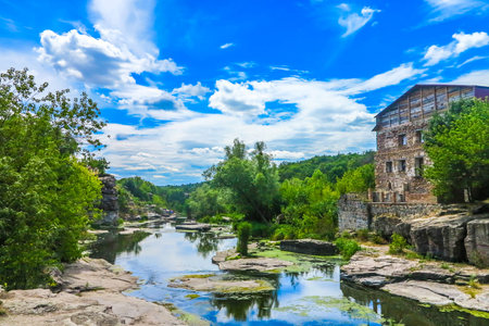 Buky Village Canyon at Hirskyi Tikych River with Abandoned Building and Blue Sky White Clouds...