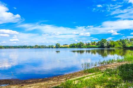 Zhashkiv City Cherkasy Oblast Lake View with Blue Sky White Clouds Backgroundの写真素材