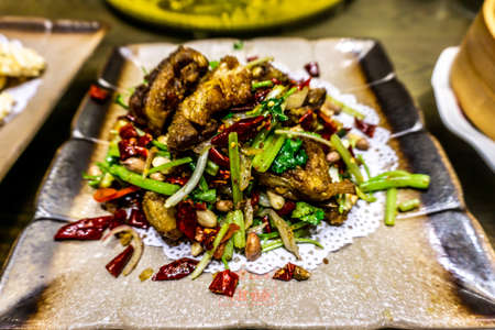 Traditional Grilled Chinese Lamb Chops with Vegetables on a Plateの写真素材