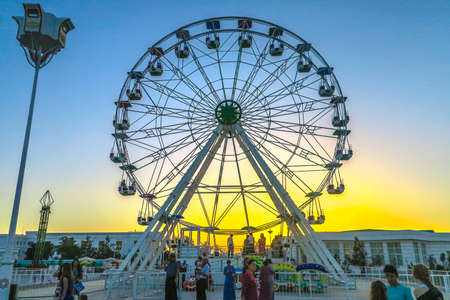 Mary Turkmenistan Amusement Park with Big Ferris Wheel at Sunsetのeditorial素材