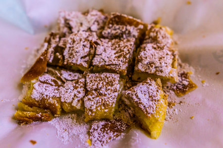 Greek Traditional Bougatsa Cream Custard Pie with Phyllo and Ground Cinnamon