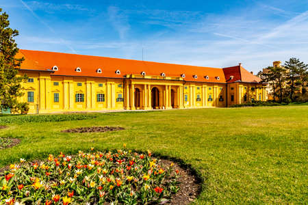Lednice Valtice Cultural Landscape Area Complex Castle Riding Hall Front View with Flowers and Picturesque Blue Sky in Springのeditorial素材