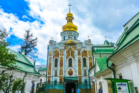 Kiev Pechersk Great Lavra Complex Fresco Trinity Church Main Entrance Gate with Golden Cupola Crossの写真素材