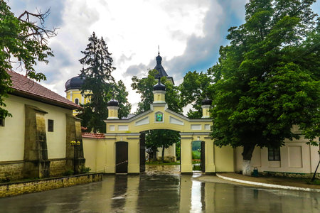Capriana Monastery Complex Main Gate Entrance View with Rainy Clouds