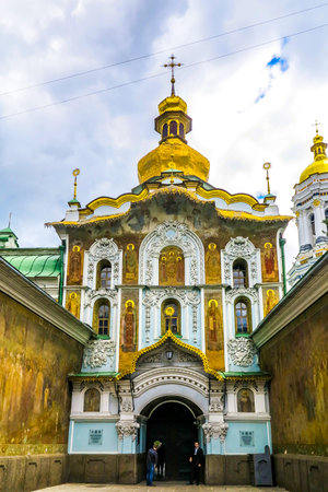Kiev Pechersk Great Lavra Complex Fresco Trinity Church Main Entrance Gate with Golden Cupola Crossの写真素材