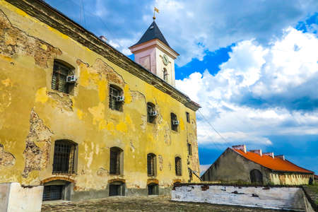 Mukachevo Palanok Castle Clock Tower Side View with Shabby Facadeのeditorial素材