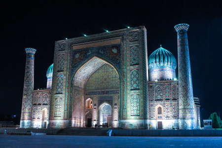Samarkand Registon Square Ensemble Sherdor Madrasa Side Viewpoint at Nightの写真素材