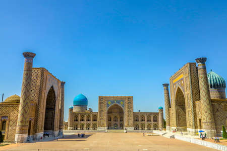 Samarkand Registon Square Ensemble Ulugbek Tilya Kori Gilded and Sherdor Madrasa Side Viewpoint at Nightの写真素材
