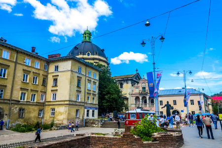 Lviv Muzeina Square Walking People with Dominican Cathedral Cupola at Background