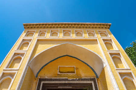 Kashgar Id Kah Mosque Low Angle View of the Yellow Colored Tiles Iwan on a Sunny Blue Sky Dayの写真素材