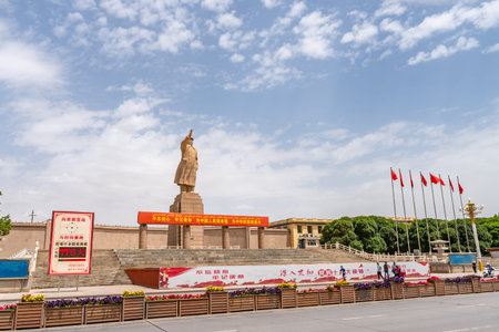 Kashgar Giant Statue of Chairman Mao Zedong at People's Park Square with Walking People and Waving...