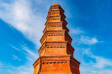 Urumqi Hong Shan Red Mountain Park with Seven Level Stupa Pagoda Low Angle View on a Sunny Blue Sky Dayのeditorial素材