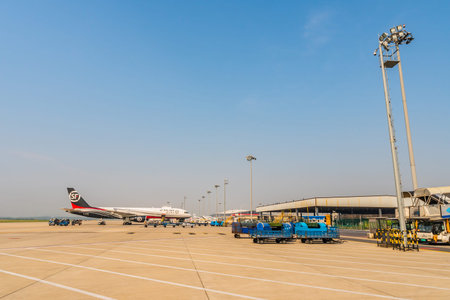 At Nanjing Lukou Airport View of SF Airlines Airplane and Baggage Carts for Cargo and Handling on a...