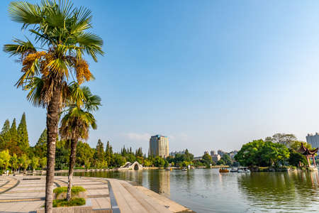 Wuhu Anhui Dajing Lake at Jinghu Gongyuan Park with Tourists and Visitors Sailing with Boats During Sunsetの写真素材