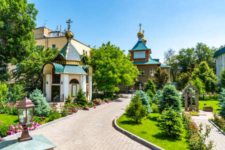 Almaty Russian Orthodox Christian Church of Saint Sophia Chapel and Garden View on a Sunny Blue Sky Dayの写真素材