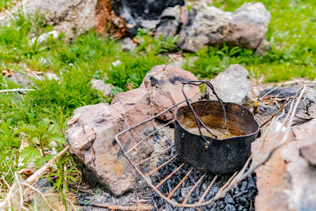 Saty Kolsai Lakes Breathtaking Picturesque View of an Old Small Camping Fire Pot on a Cloudy Blue...