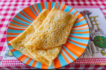 Traditional Mouthwatering French Style Crepes Filled with Chocolate Cream Served on a Plateの写真素材