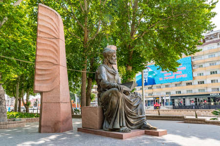 Khujand Zvezdy Khujanda Square with Statue of Abu Abdullah Rudaki on a Sunny Blue Sky Dayの写真素材