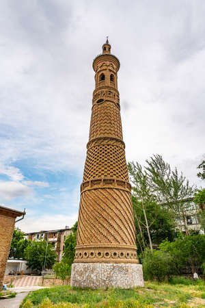 Istaravshan Hazrati Shoh Mosque Picturesque View of Minaret Tower on a Cloudy Rainy Dayの写真素材