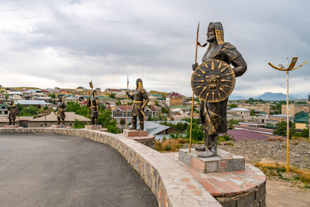 Istaravshan Kalai Mug Teppe Fortress View with Statue of Several Warriors and Cityscape on a Cloudy...