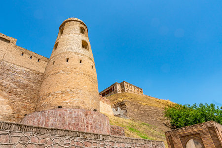 Hisor Fortress Main Gate Entrance Walls Picturesque Breathtaking Tower View on a Sunny Blue Sky Dayのeditorial素材