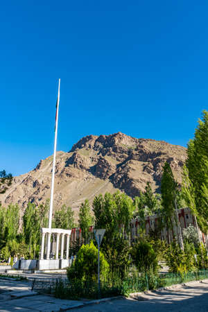 Khorugh GBAO Gorno-Badakhshan Autonomous Region Government Building View of Flag Pole on a Sunny Blue Sky Dayのeditorial素材