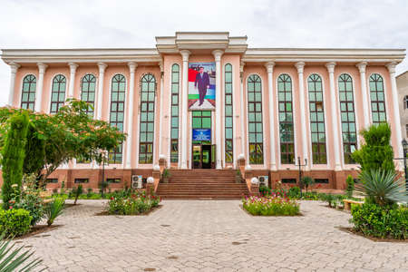 Qurghonteppa Bokhtar History Museum of Khatlon Province with President Emomali Rahmon Portrait on a Cloudy Rainy Dayのeditorial素材