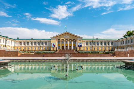 Khujand Arbob Cultural Palace View with Waving Tajikistan Flag and Portraits of Ismoil Somoni and President Emomali Rahmon on a Sunny Blue Sky Dayのeditorial素材