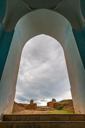 Kulob Vose Hulbuk Fortress Picturesque View of Entrance Gate on a Cloudy Rainy Blue Sky Dayのeditorial素材