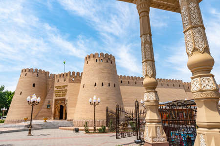 Khujand Sughd Region Historical Museum Main Gate Entrance View with Waving Tajikistan Flag on a Sunny Blue Sky Dayのeditorial素材