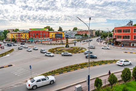 Qurghonteppa Bokhtar City Center Ring Road Clocktower Ayni Street and Vakhdat Prospekt High Angle View with Busy Car Traffic in the Morningのeditorial素材