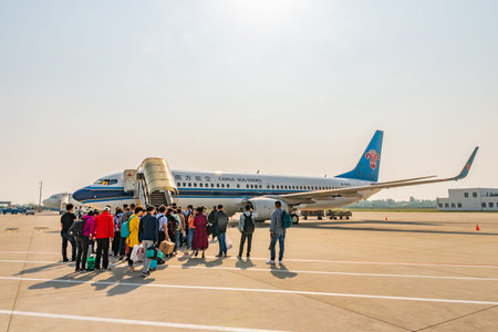 At Nanjing Lukou Airport Passengers are Waiting Outside for Boarding the China Southern Airlines...