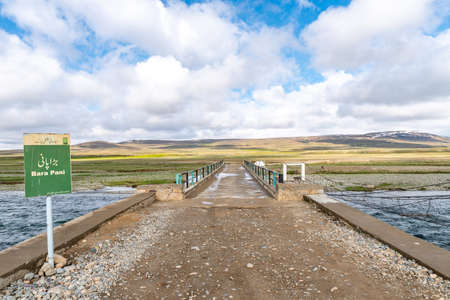 Deosai National Park Picturesque Breathtaking View of Bara Pani River Bridge on a Sunny Blue Sky Dayの写真素材