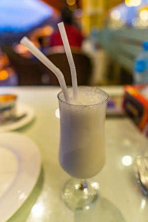 Traditional Mouthwatering Pakistani Common Sweetened Lassi Picturesque View in a Tall Glassの写真素材