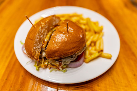 Traditional Mouthwatering American Juicy Angus Beef Double Cheeseburger with French Fries