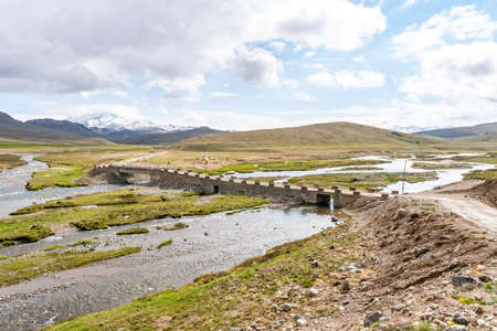 Deosai National Park Picturesque Breathtaking View of Bara Pani River Bridge on a Sunny Blue Sky Dayの写真素材