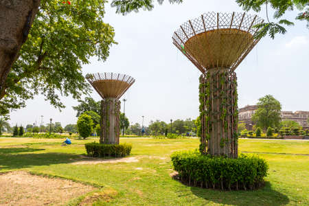 Lahore Iqbal Park Picturesque View of Two Pillars with Clipped Hedges on a Sunny Blue Sky Dayの写真素材